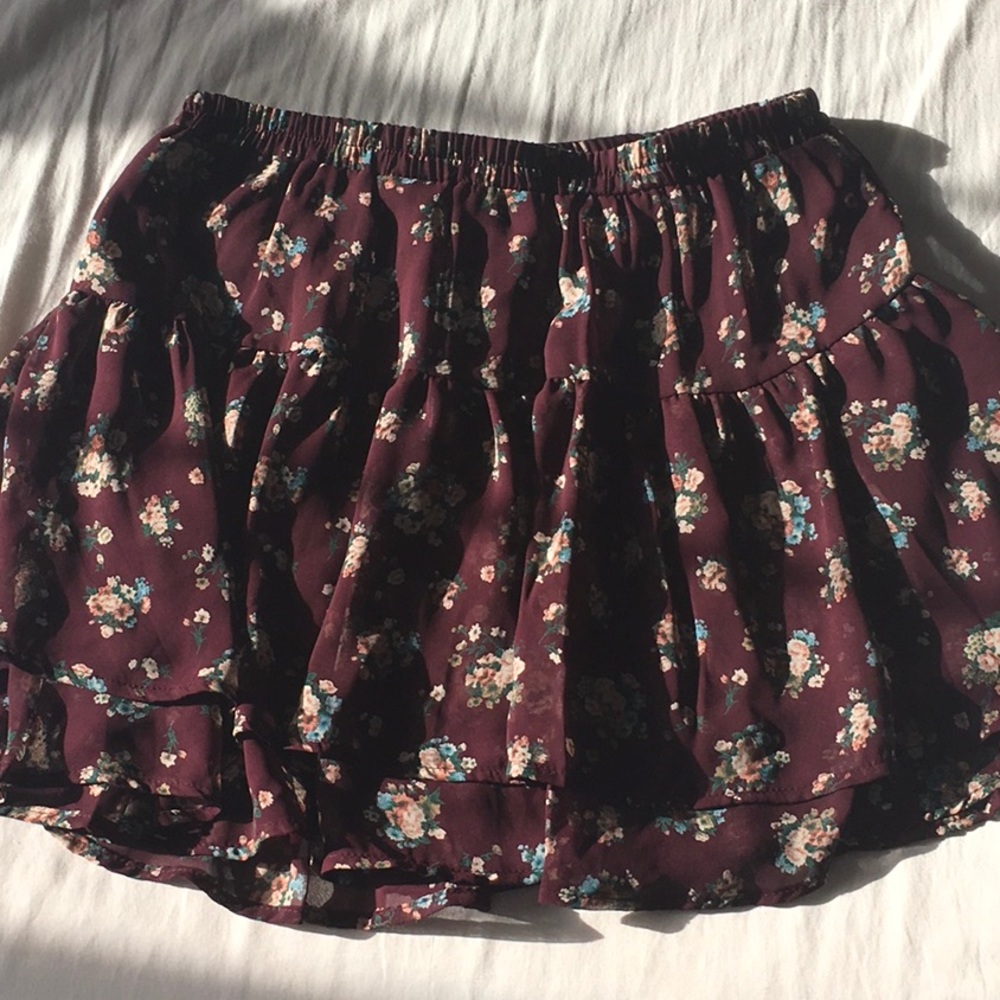 Maroon skirt with blue, white, and pink flowers